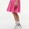 Abito polo elasticizzato a pieghe per bambina Abito polo elasticizzato a pieghe per bambina
