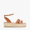 Espadrillas con plateau e cinturini intrecciati in pelle Espadrillas con plateau e cinturini intrecciati in pelle