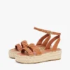 Espadrillas con plateau e cinturini intrecciati in pelle Espadrillas con plateau e cinturini intrecciati in pelle