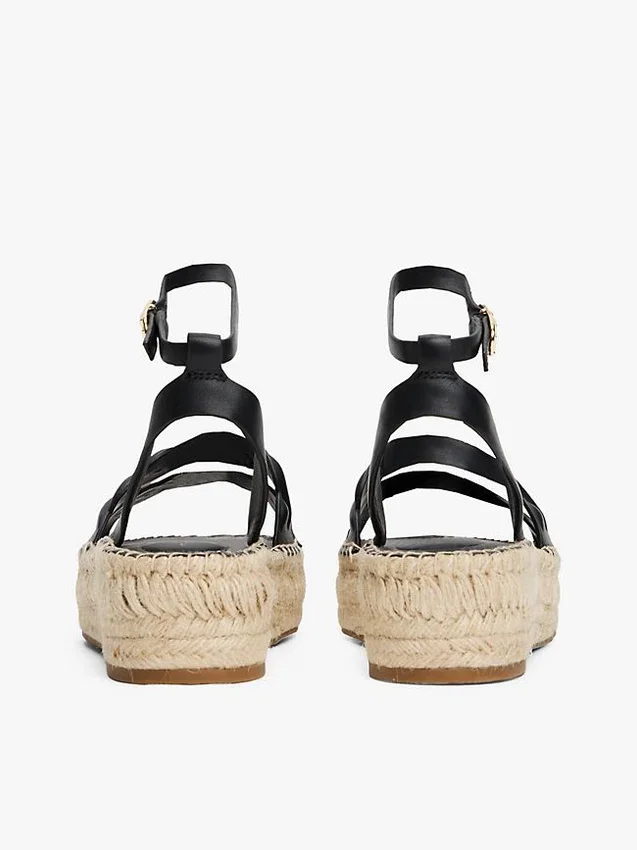 Espadrillas con plateau e cinturini intrecciati in pelle Espadrillas con plateau e cinturini intrecciati in pelle