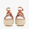 Espadrillas con plateau e cinturini intrecciati in pelle Espadrillas con plateau e cinturini intrecciati in pelle