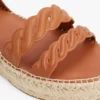Espadrillas con plateau e cinturini intrecciati in pelle Espadrillas con plateau e cinturini intrecciati in pelle