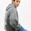 Felpa con cappuccio Tommy Jeans con logo verniciato a spruzzo Felpa con cappuccio Tommy Jeans con logo verniciato a spruzzo