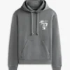 Felpa con cappuccio Tommy Jeans con logo verniciato a spruzzo Felpa con cappuccio Tommy Jeans con logo verniciato a spruzzo