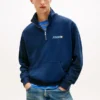 Felpa con logo Tommy Jeans e zip a un quarto Felpa con logo Tommy Jeans e zip a un quarto