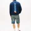 Felpa con logo Tommy Jeans e zip a un quarto Felpa con logo Tommy Jeans e zip a un quarto
