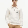 Felpa polo con logo floreale e zip a un quarto Felpa polo con logo floreale e zip a un quarto