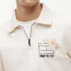 Felpa polo con logo floreale e zip a un quarto Felpa polo con logo floreale e zip a un quarto