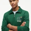 Felpa polo con logo floreale e zip a un quarto Felpa polo con logo floreale e zip a un quarto