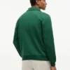 Felpa polo con logo floreale e zip a un quarto Felpa polo con logo floreale e zip a un quarto