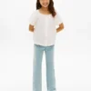 Jeans a zampa con tasche applicate e vestibilità comoda per bambina Jeans a zampa con tasche applicate e vestibilità comoda per bambina