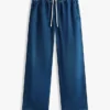 Jeans leggeri a gamba larga senza bottoni Jeans leggeri a gamba larga senza bottoni