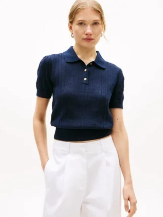 Maglia polo a trama traforata con logo bandiera su tutta la superficie