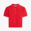 Maglia polo a trama traforata con logo bandiera su tutta la superficie Maglia polo a trama traforata con logo bandiera su tutta la superficie