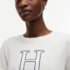 Maglietta con logo H floreale Maglietta con logo H floreale