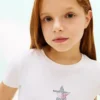 Maglietta per bambini con bandiera a stelle e strisce in strass Maglietta per bambini con bandiera a stelle e strisce in strass