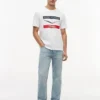 Maglietta Tommy x Cadillac F1® Team Chevron Maglietta Tommy x Cadillac F1® Team Chevron