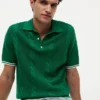 Maglione polo a maniche corte con lavorazione a trecce