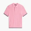Maglione polo a maniche corte con lavorazione a trecce