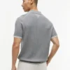 Maglione polo a maniche corte con lavorazione a trecce