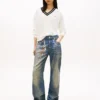 Maglione Tommy Jeans con scollo a V e vestibilità comoda Maglione Tommy Jeans con scollo a V e vestibilità comoda