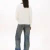 Maglione Tommy Jeans con scollo a V e vestibilità comoda Maglione Tommy Jeans con scollo a V e vestibilità comoda