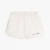 Pantaloncini da bambina con logo Tommy glitterato Pantaloncini da bambina con logo Tommy glitterato