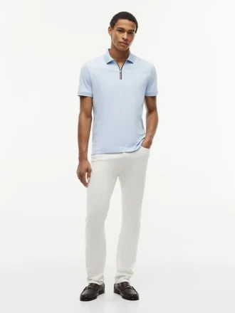 Polo con zip in cotone liscio, vestibilità regolare