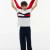 Polo elasticizzata con bandiera a blocchi di colore per bambini Polo elasticizzata con bandiera a blocchi di colore per bambini