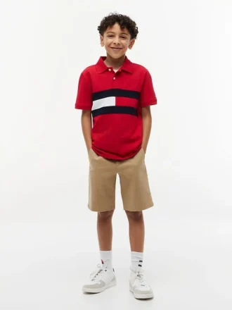 Polo elasticizzata con bandiera a blocchi di colore per bambini Polo elasticizzata con bandiera a blocchi di colore per bambini
