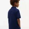 Polo elasticizzata con bandiera a blocchi di colore per bambini Polo elasticizzata con bandiera a blocchi di colore per bambini