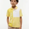 Polo elasticizzata con logo a blocchi di colore per bambini Polo elasticizzata con logo a blocchi di colore per bambini