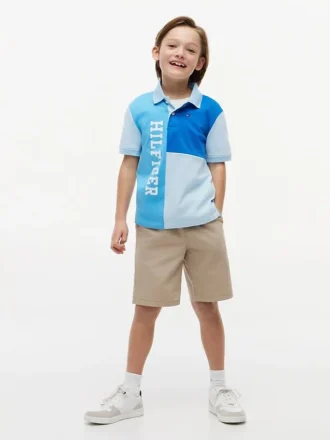 Polo elasticizzata con logo a blocchi di colore per bambini