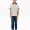 Polo elasticizzata con logo nautico su tutta la superficie per bambini Polo elasticizzata con logo nautico su tutta la superficie per bambini