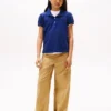 Polo elasticizzata con maniche a sbuffo per bambini Polo elasticizzata con maniche a sbuffo per bambini