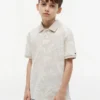 Polo elasticizzata con stampa tropicale per bambini Polo elasticizzata con stampa tropicale per bambini