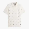 Polo in piqué con bandiera su tutto il capo, vestibilità regolare Polo in piqué con bandiera su tutto il capo, vestibilità regolare