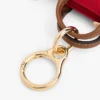 Portamonete con monogramma e ciondolo per borsa Portamonete con monogramma e ciondolo per borsa
