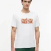 T-shirt con logo floreale tropicale T-shirt con logo floreale tropicale