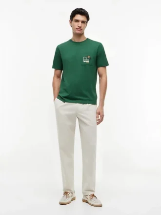 T-shirt con tasca e logo bandiera floreale