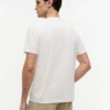 T-shirt con tasca e logo bandiera floreale T-shirt con tasca e logo bandiera floreale