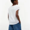 T-shirt da bambino con logo floreale in paillettes T-shirt da bambino con logo floreale in paillettes