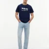 T-shirt Hilfiger con logo multi-bandiera T-shirt Hilfiger con logo multi-bandiera