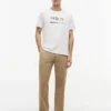 T-shirt Hilfiger con logo multi-bandiera T-shirt Hilfiger con logo multi-bandiera