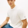 T-shirt in jacquard con logo bandiera su tutta la superficie T-shirt in jacquard con logo bandiera su tutta la superficie