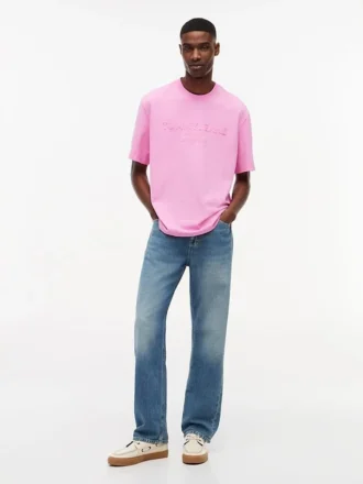 T-shirt Tommy Jeans con logo effetto consumato
