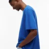T-shirt Tommy Jeans con logo effetto consumato T-shirt Tommy Jeans con logo effetto consumato