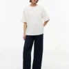 T-shirt Tommy Jeans con logo in cristallo T-shirt Tommy Jeans con logo in cristallo