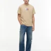 T-shirt Tommy Jeans con logo Multi-Crest T-shirt Tommy Jeans con logo Multi-Crest
