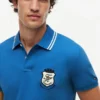 Vestibilità regolare Polo in piqué con stemma monogramma Vestibilità regolare Polo in piqué con stemma monogramma